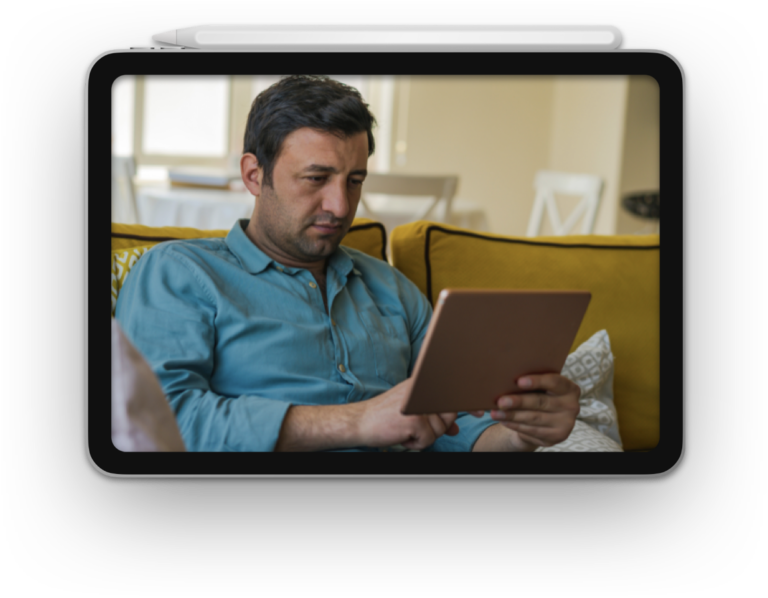 Man learning to read on IPad Tablet